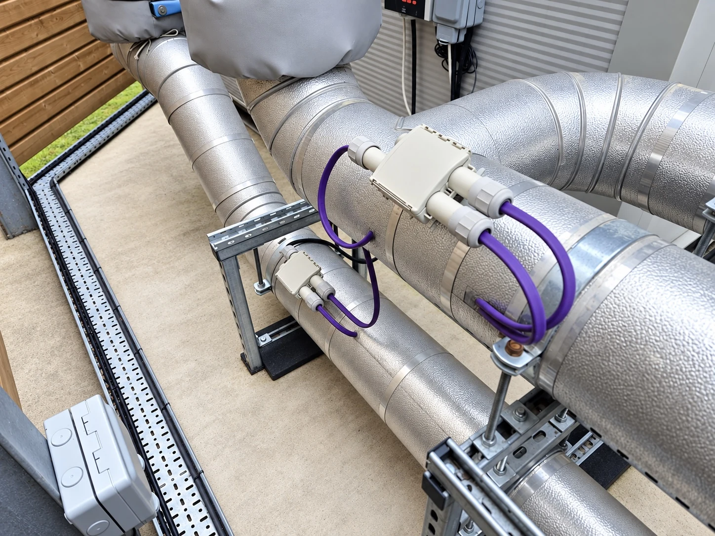 Trace heating cables and connection boxes fitted to insulated pipework